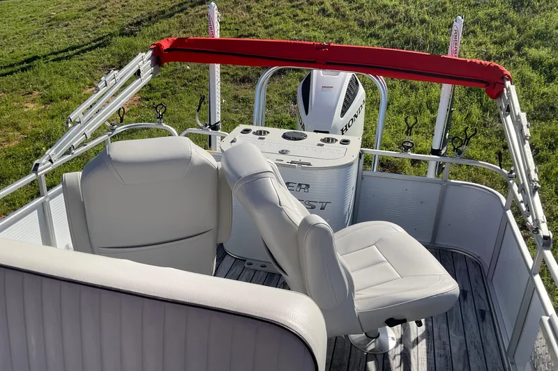 Slide: The Image of 2019 Angler Quest 826 CRAPPIE boat interior with seating and Honda motor. - 8