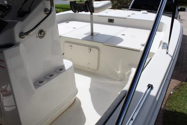 Slide: The Image of 2021 Carolina Skiff 17 LS boat interior with seating and storage compartments. - 10