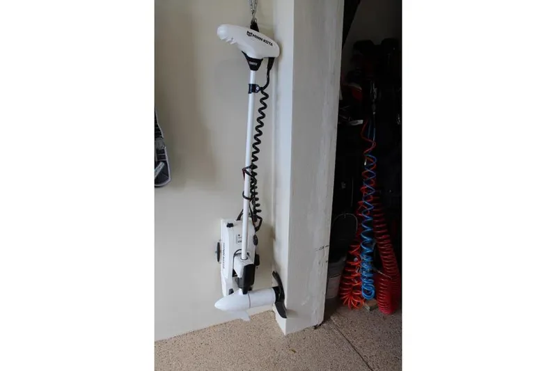 Slide: The Image of Minn Kota trolling motor mounted on a wall, suitable for Carolina Skiff 17 LS 2021. - 12