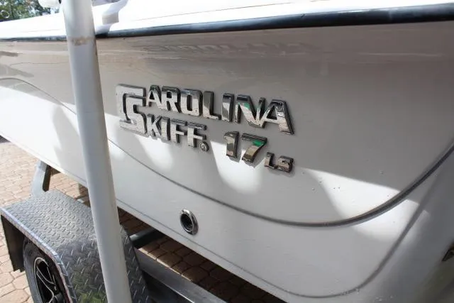 Slide: The Image of 2021 Carolina Skiff 17 LS boat on trailer, close-up of logo and model name. - 3