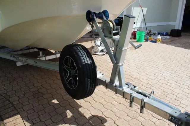 Slide: The Image of Trailer for 2021 Carolina Skiff 17 LS boat on paved driveway. - 4