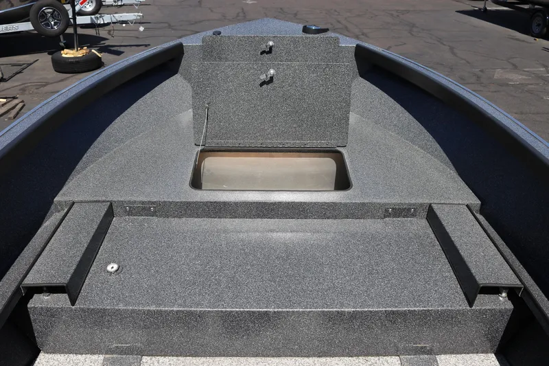 Slide: The Image of 2025 Alumaweld Free Drifter 20 boat interior with storage compartments and seating area. - 13