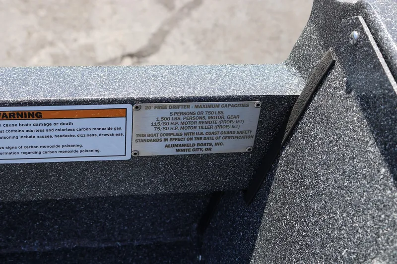 Slide: The Image of 2025 Alumaweld Free Drifter 20 boat capacity and safety warning labels. - 21