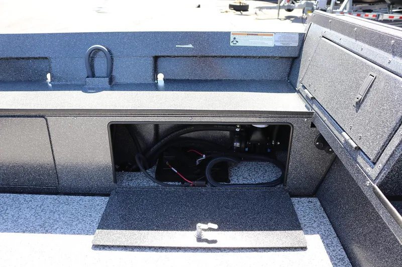 Slide: The Image of 2025 Alumaweld Free Drifter 20 boat interior storage compartment with open hatch. - 22