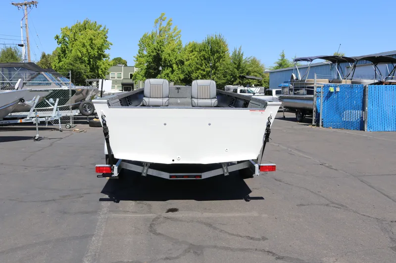 Slide: The Image of 2025 Alumaweld Free Drifter 20 boat on trailer in outdoor lot. - 3