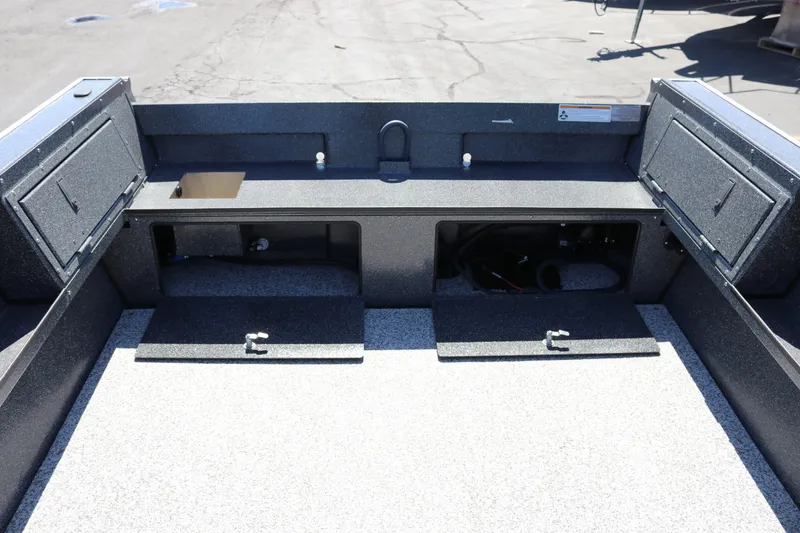 Slide: The Image of 2025 Alumaweld Free Drifter 20 boat interior with storage compartments and durable flooring. - 5