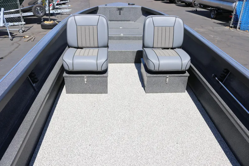 Slide: The Image of 2025 Alumaweld Free Drifter 20 boat interior with two gray seats on a textured floor. - 6