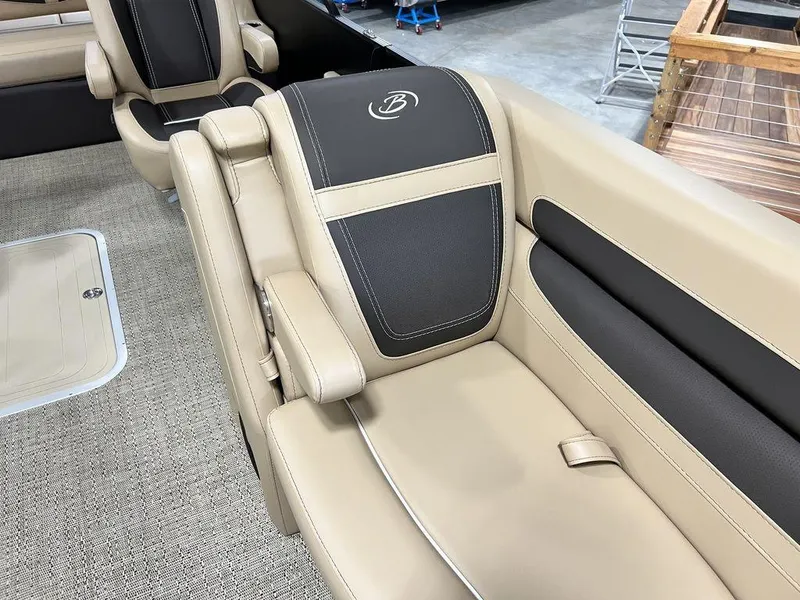 Slide: The Image of 2025 Barletta CABRIO C24UC boat interior with beige and black leather seating. - 10
