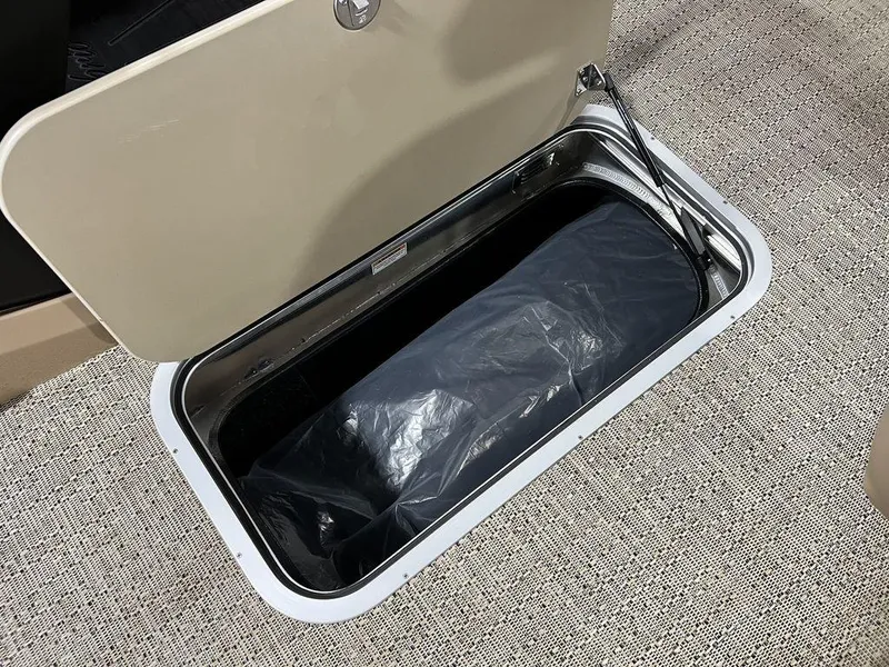 Slide: The Image of Open storage compartment in 2025 Barletta CABRIO C24UC boat. - 20