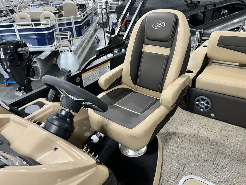 Slide: The Image of 2025 Barletta Cabrio C24UC boat interior with captain's chair and steering wheel. - 30