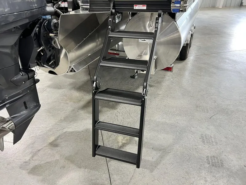 Slide: The Image of Barletta CABRIO C24UC 2025 boat with foldable ladder and outboard motor. - 5