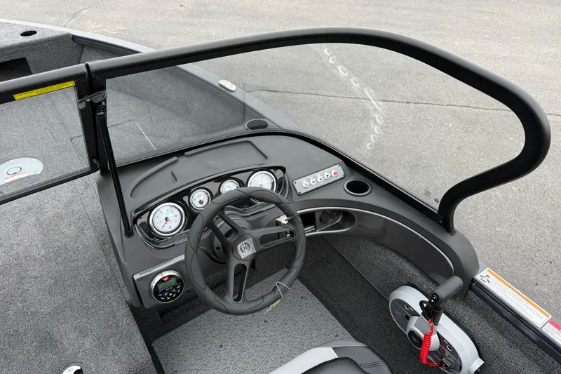 Slide: The Image of 2026 Crestliner 1750 Hawk boat dashboard with steering wheel and instrument panel. - 10