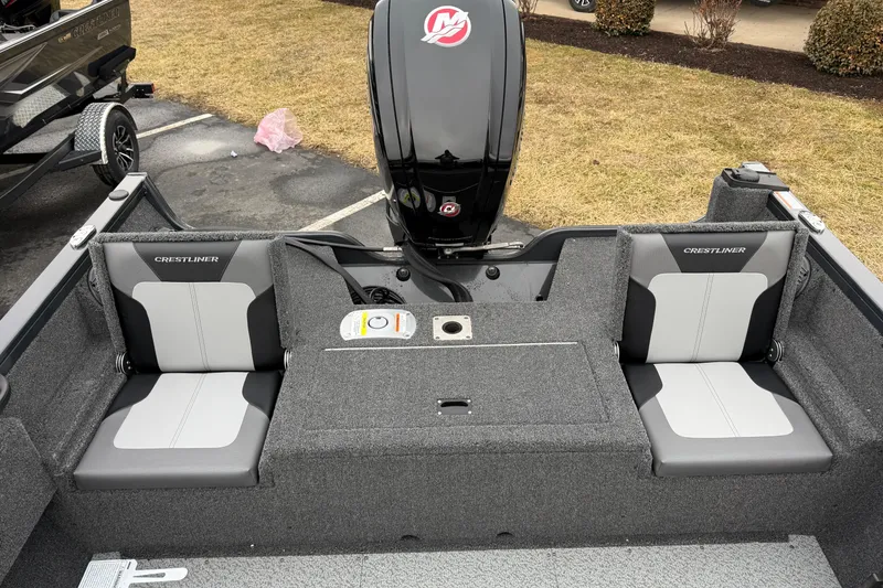 Slide: The Image of 2026 Crestliner 1750 Hawk boat interior with dual seats and motor. - 13