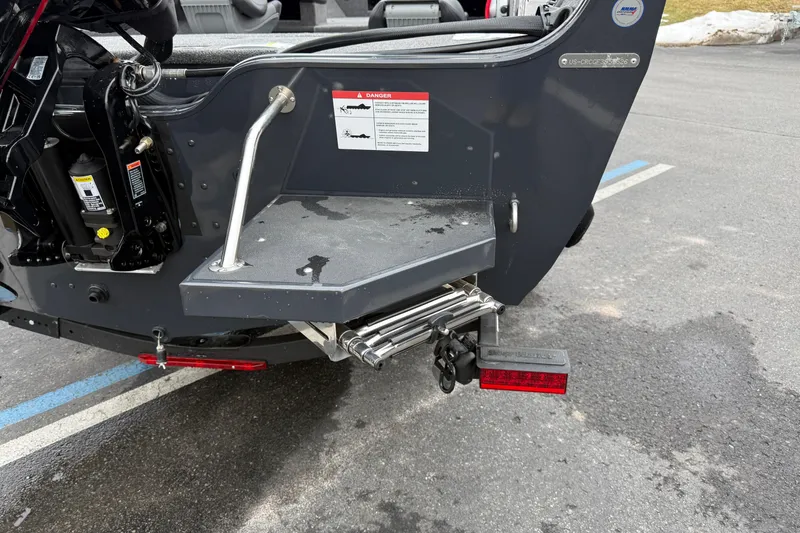 Slide: The Image of 2026 Crestliner 1750 Hawk boat stern with ladder and warning label. - 3