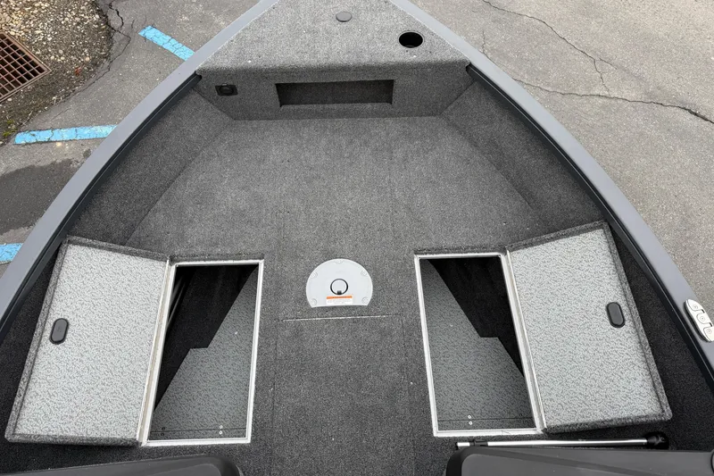 Slide: The Image of 2026 Crestliner 1750 Hawk boat interior with open storage compartments. - 7