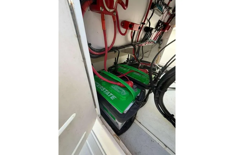 Slide: The Image of Battery compartment of a 1992 Baja 280 Sportfish with Interstate batteries and wiring. - 13