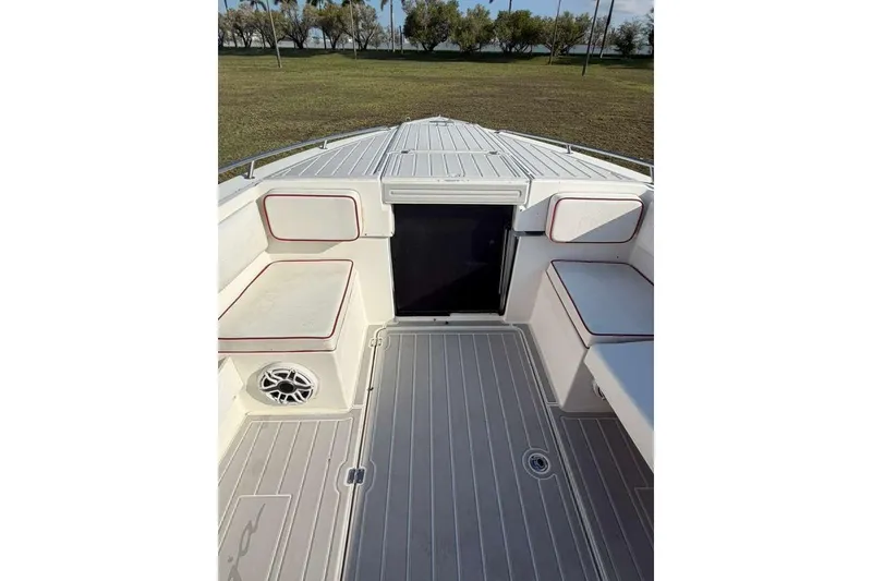 Slide: The Image of 1992 Baja 280 Sportfish boat interior with cushioned seating and deck view. - 18