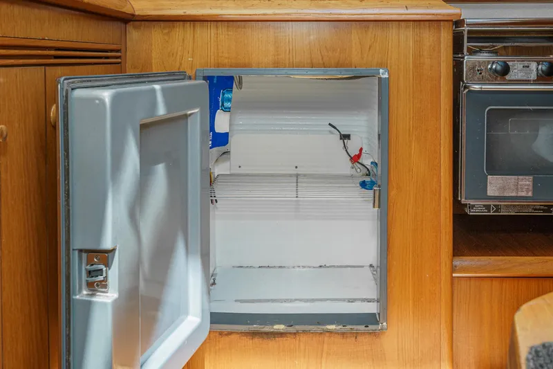 Slide: The Image of Open fridge in 2002 Jeanneau Sun Odyssey 43 yacht kitchen interior. - 47