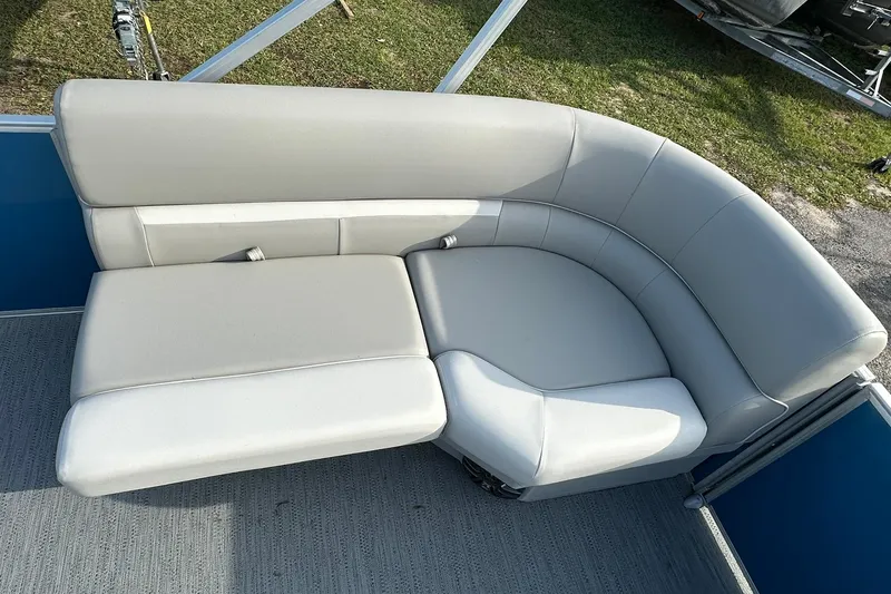 Slide: The Image of 2026 Sweetwater EX 2286 SFLX boat seating, featuring plush, light gray upholstery. - 12