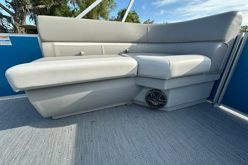 Slide: The Image of Luxurious seating on 2026 Sweetwater EX 2286 SFLX pontoon boat, featuring sleek gray upholstery. - 13