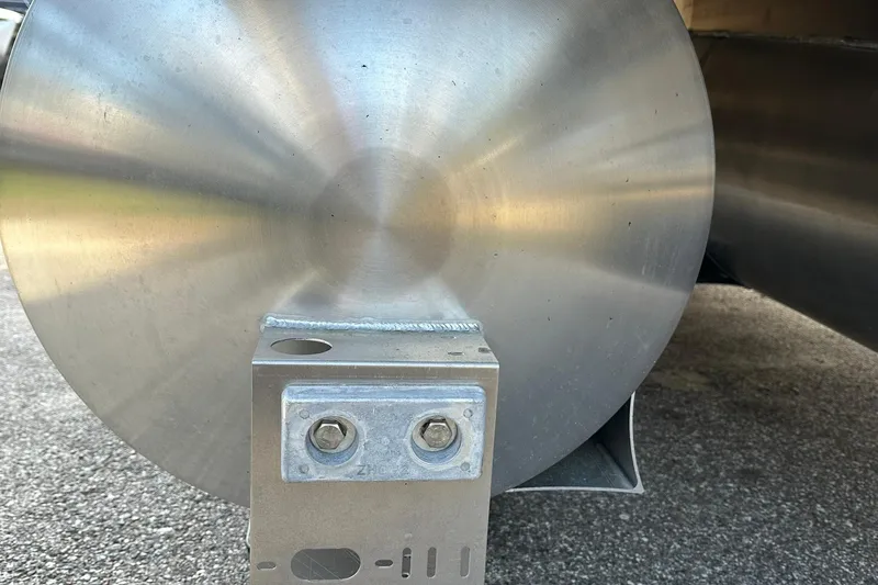 Slide: The Image of Close-up of Sweetwater EX 2286 SFLX 2026 pontoon detail on asphalt surface. - 28