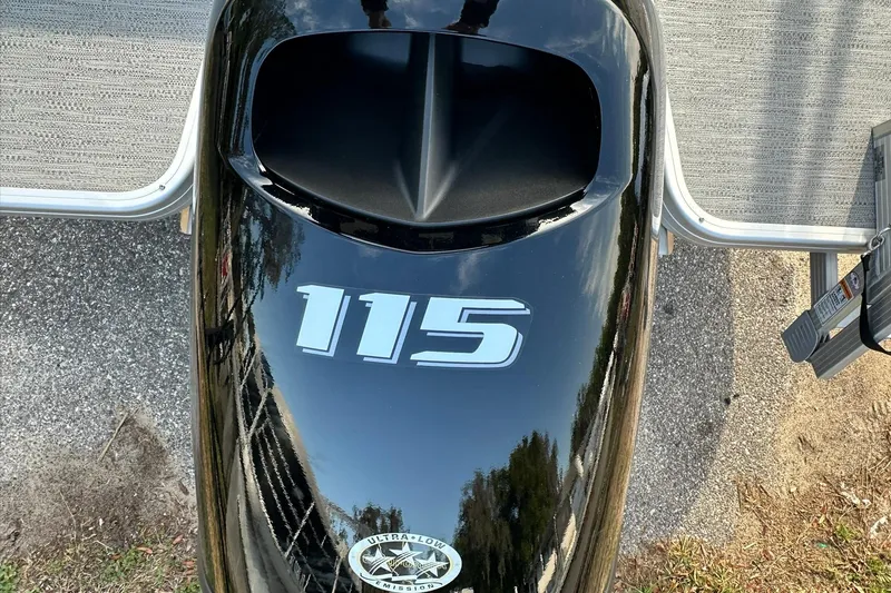 Slide: The Image of Top view of a 2026 Sweetwater EX 2286 SFLX boat engine with "115" marking. - 7