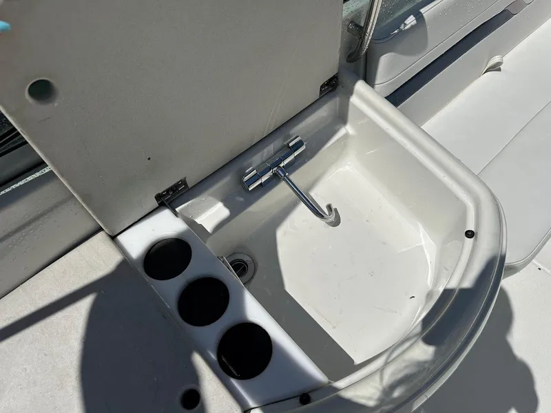 Slide: The Image of Boat sink with faucet and cup holders on a 2000 Formula 330 SS. - 12