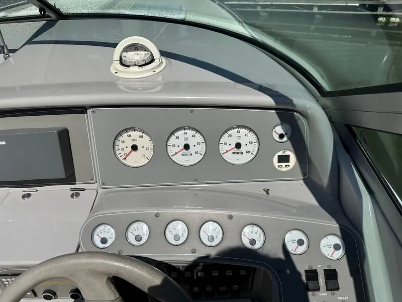Slide: The Image of Dashboard of a 2000 Formula 330 SS boat with gauges and controls. - 16