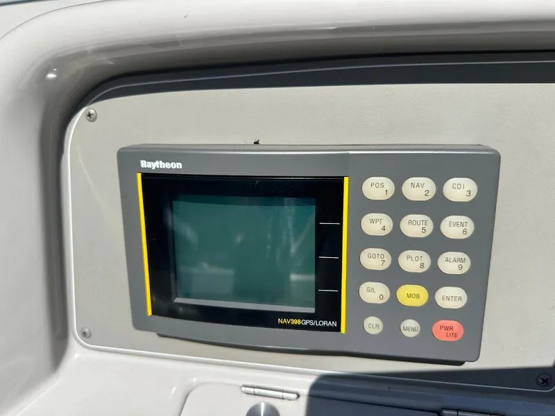 Slide: The Image of Raytheon NAV398 GPS display on 2000 Formula 330 SS boat dashboard. - 17