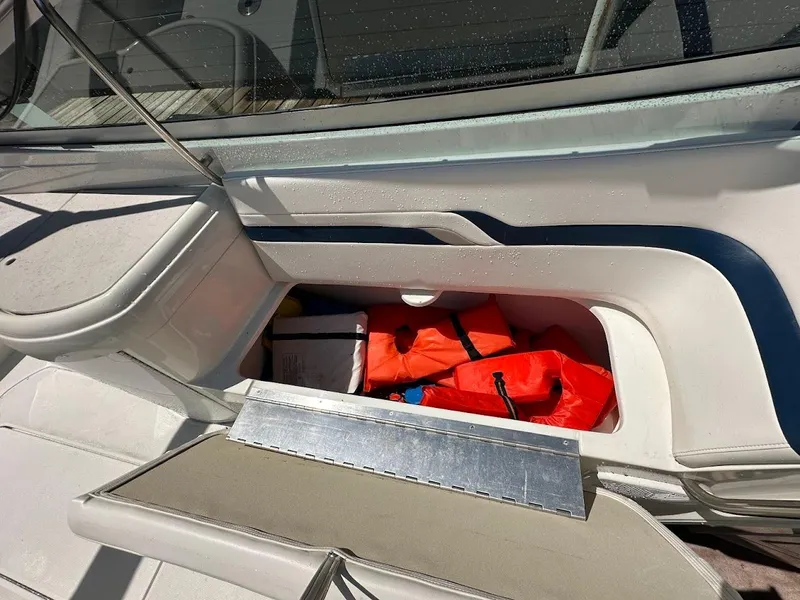 Slide: The Image of Storage compartment on a 2000 Formula 330 SS boat with life jackets inside. - 20