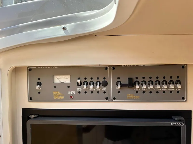 Slide: The Image of Control panel of a 2000 Formula 330 SS boat, featuring various switches and indicators. - 28