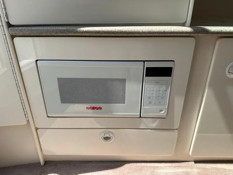 Slide: The Image of Built-in microwave in a 2000 Formula 330 SS boat interior. - 29