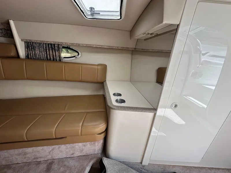 Slide: The Image of Interior of 2000 Formula 330 SS boat with tan seating and compact kitchenette. - 31