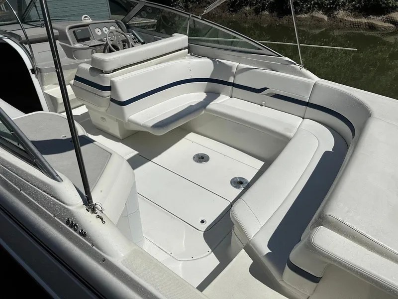 Slide: The Image of 2000 Formula 330 SS boat interior with white seating and steering console. - 4