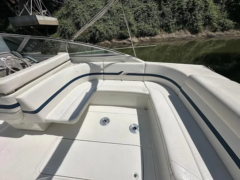 Slide: The Image of 2000 Formula 330 SS boat interior with white seating and blue accents. - 6