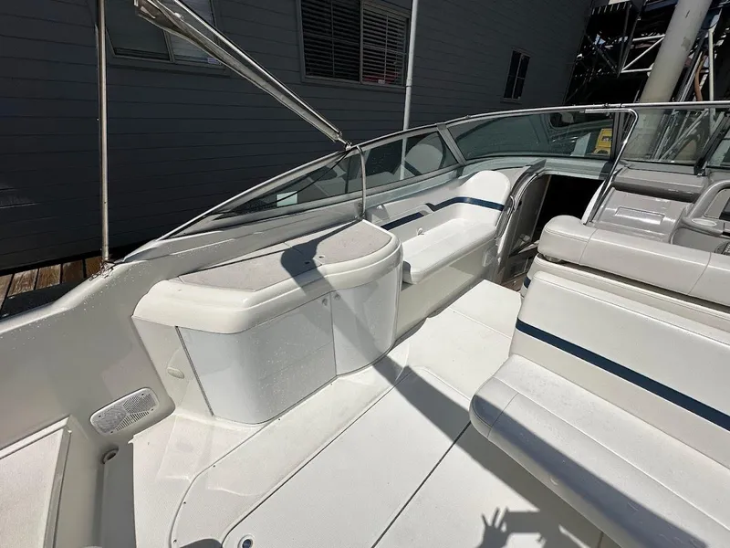 Slide: The Image of 2000 Formula 330 SS boat interior with white seating and sleek design. - 8