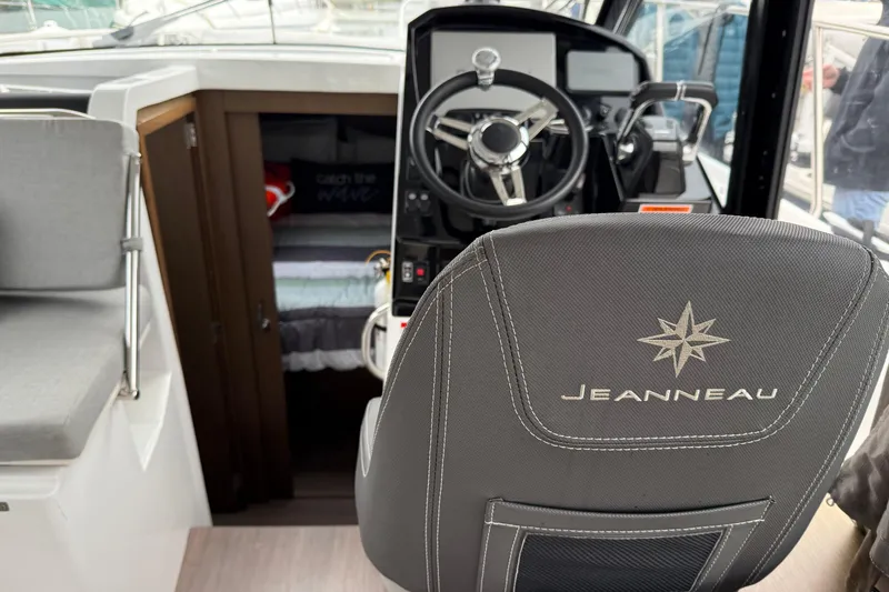 Slide: The Image of Interior view of 2020 Jeanneau NC 895 boat cockpit and cabin entrance. - 15