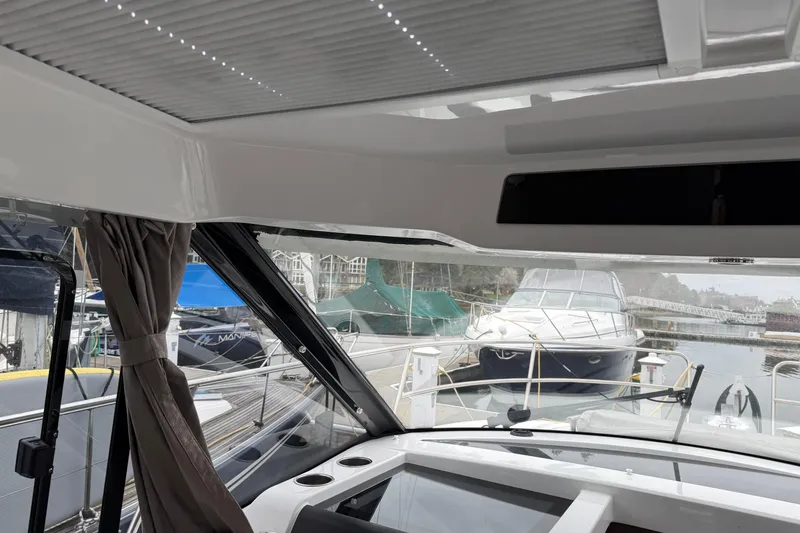 Slide: The Image of Interior view of 2020 Jeanneau NC 895 boat docked at marina. - 30
