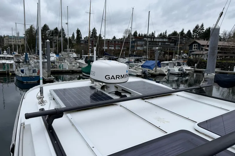 Slide: The Image of 2020 Jeanneau NC 895 with Garmin radar and solar panels at marina. - 33