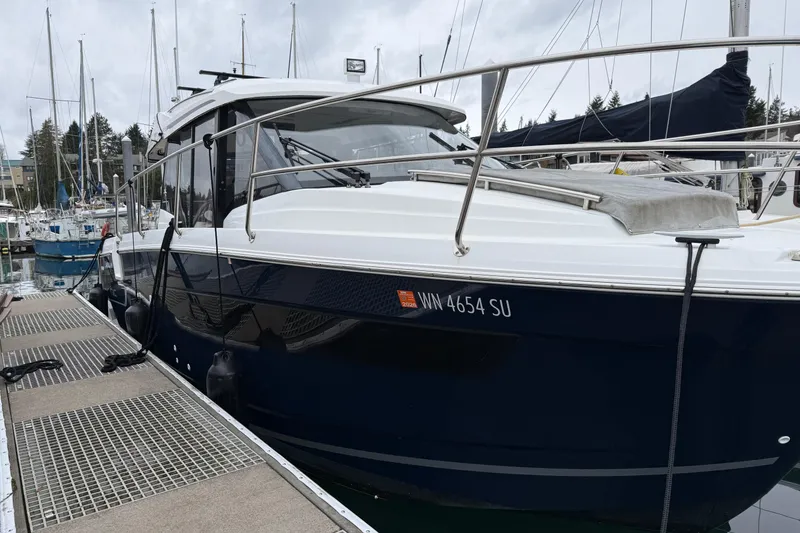 Slide: The Image of 2020 Jeanneau NC 895 boat docked at marina, side view. - 34