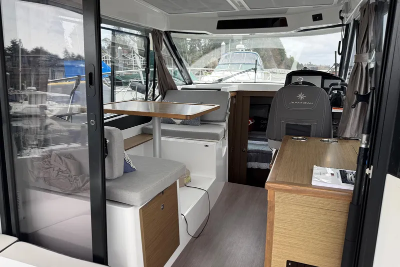 Slide: The Image of Interior of 2020 Jeanneau NC 895 boat with seating and helm station. - 6