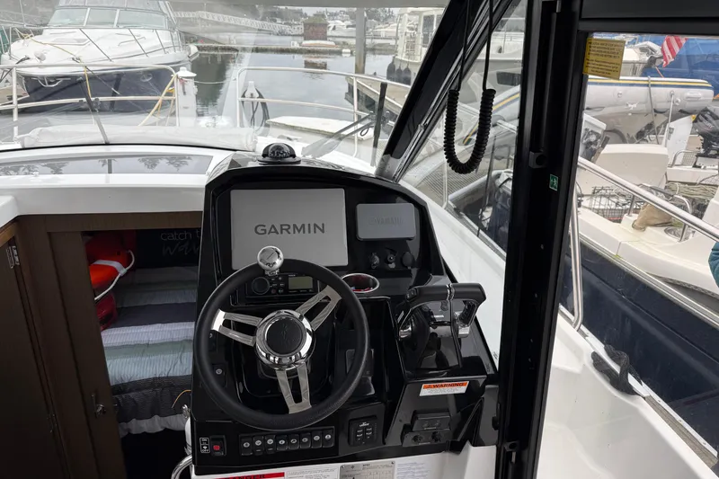 Slide: The Image of Interior helm of 2020 Jeanneau NC 895 boat with Garmin navigation system. - 7