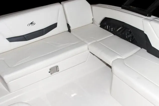 Slide: The Image of Manufacturer Provided Image: 2015 Monterey 268SS Super Sport boat interior with white seating and dashboard. - 11