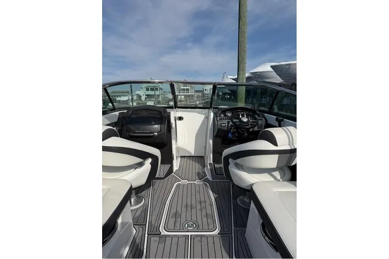 Slide: The Image of Interior view of 2015 Monterey 268SS Super Sport boat with sleek seating and dashboard. - 2