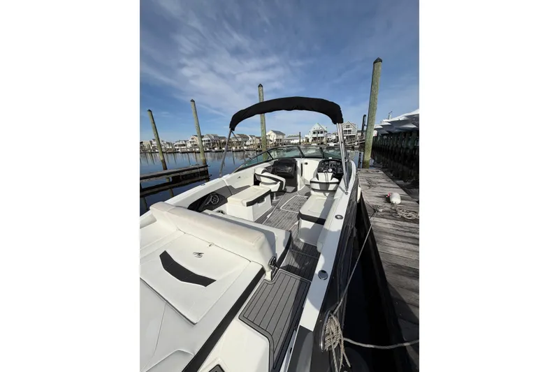 Slide: The Image of 2015 Monterey 268SS Super Sport boat docked at marina under clear sky. - 6