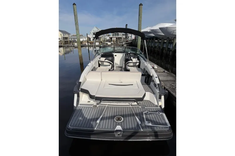 Slide: The Image of 2015 Monterey 268SS Super Sport boat docked at marina, featuring spacious seating and sleek design. - 7