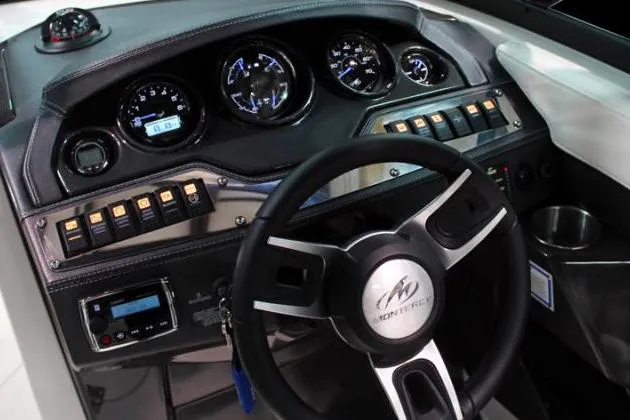 Slide: The Image of Manufacturer Provided Image: Dashboard of a 2015 Monterey 268SS Super Sport boat with steering wheel and gauges. - 9