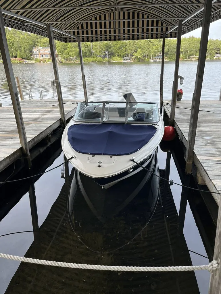 Slide: The Image of Chaparral 21 SSI Sport 2020 in boathouse by the lake. - 2