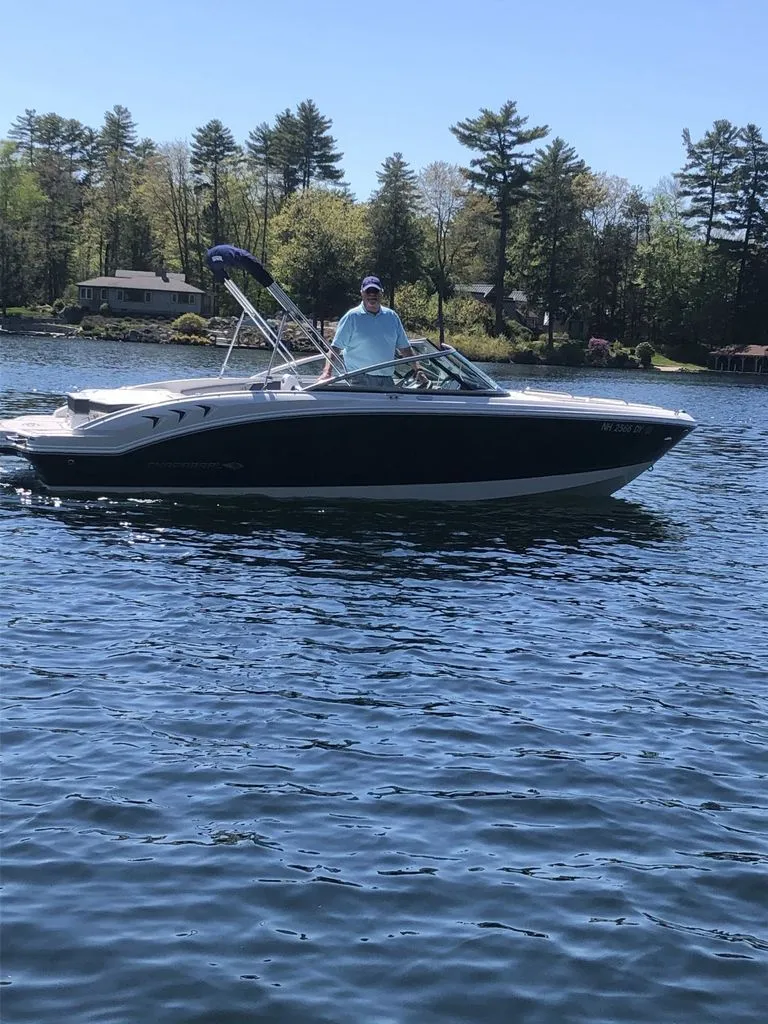 Slide: The Image of 2020 Chaparral 21 SSI Sport boat on a serene lake. - 4