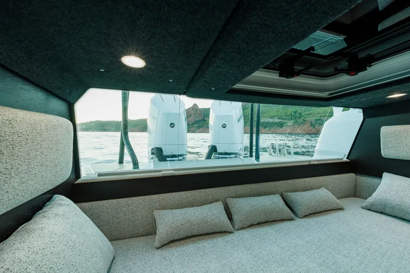 Slide: The Image of Interior view of 2026 Axopar 45 XC Cross Cabin with scenic ocean backdrop. - 11